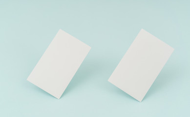 Blank business card on blue background .