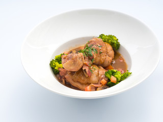 Rooster cooked in red wine.
