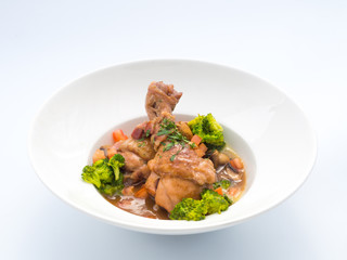 Rooster cooked in red wine.
