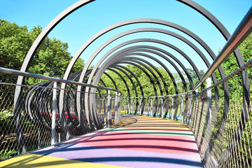 abstract multicolored bridge with metal rings.