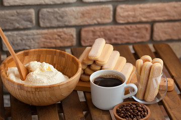 Cooking Tiramisu concept step by step. Homemade tiramisu cake. Ingredients for making perfect Italian dessert.