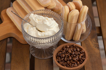 Cooking Tiramisu concept step by step. Homemade tiramisu cake. Ingredients for making perfect Italian dessert.
