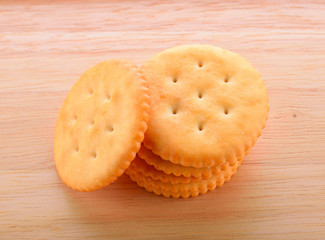 Cookies on the dish with wooden ground.