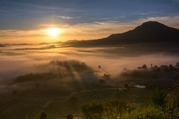 mist over the valley of mountain at sun rising giving a beautiful 