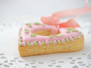 Heart shaped Christmas sugar cookies. Gingerbread glazed with royal icing. Macro image. Selective focus.
