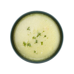 Potato and green vegetables soup, isolated on white background
