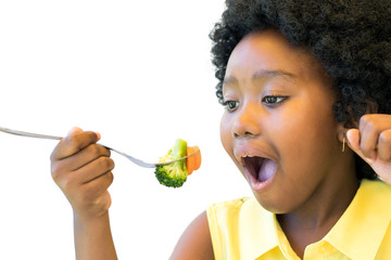 African kid eating vegetables.