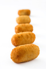 Traditional fried Spanish croquetas (croquettes) isolated on white background
