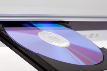 Close up of a DVD player ejecting disc .