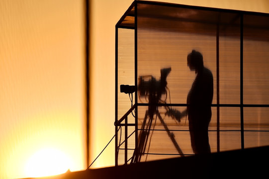 Cameraman's silhouette broadcasting
