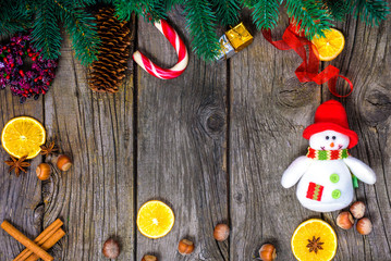 Christmas wooden background with snow fir tree. View copy space