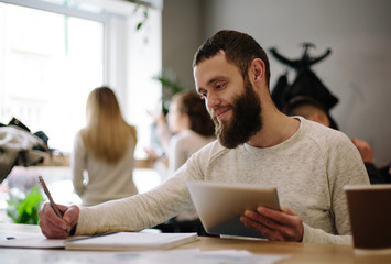 Man using tablet pc at the office