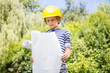 Cute boy pretending to be a worker