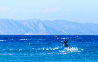 Attractive Young Woman KiteBoarding, Fun in ocean, Extreme Sport Kitesurfing