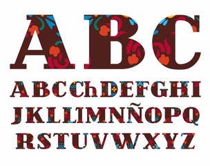 Spanish alphabet, decorative flowers, vector font, capital letters, brown. The letters of the Spanish alphabet with serifs. Red and blue flowers on a brown background. 
