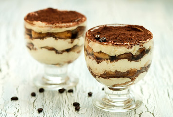 Italian dessert tiramisu in glass, sweet food