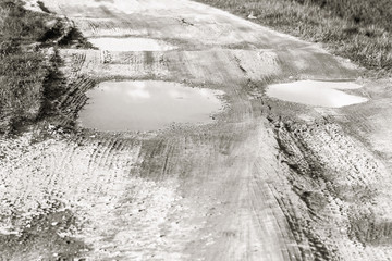 Big puddles on dirt road