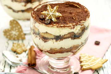 Italian festive dessert tiramisu in glass, sweet food, homemade