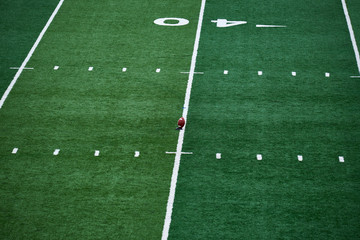 American football field, of Columbia University in New York City, with a ball standing on the 40...