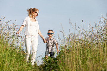 Mother and son playing on the park at the day time.