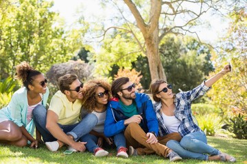 Group of friends taking a selfie with the mobile phone