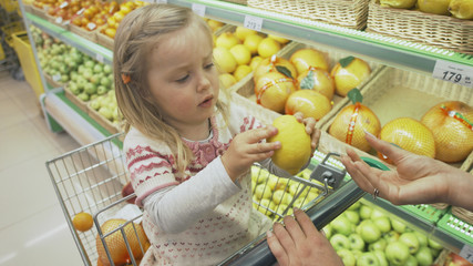 Family makes purchases in the supermarket