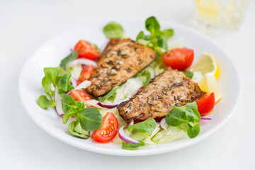 roasted mackerel fish with fresh salad,
