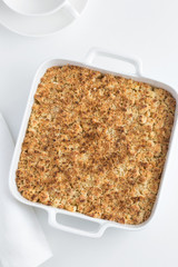 crumble pie in white baking dish
