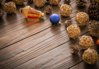 Rustic wood background with pine cones. Dark brown colors.