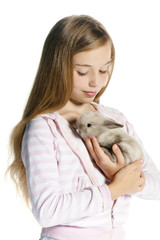 Happy little girl with rabbit