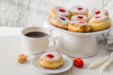 Symbols of Hanukkah celebration on wood background