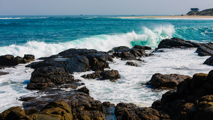 Massive rolling waves crashing into the rocks near Margaret beach, Western Australia