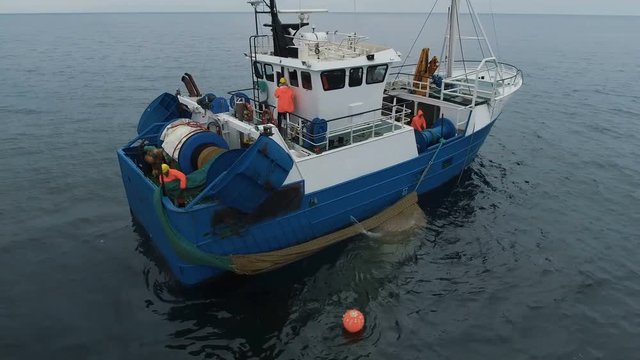 Flying Around Commercial Fishing Ship with Trawl Net full of Fish. Shot on RED Cinema Camera in 4K (UHD). 