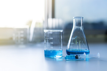 Laboratory glassware, bottle, flasks for experiment in lab.