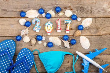 Christmas vacation - plane, map, passport on the wooden desk