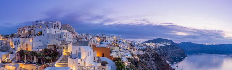 cityscape of Oia, traditional greek village of Santorini at sunset, Greece