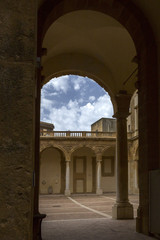 courtyard with arcades and baroque building