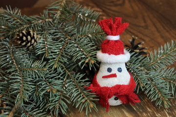 Snowman near the Christmas tree