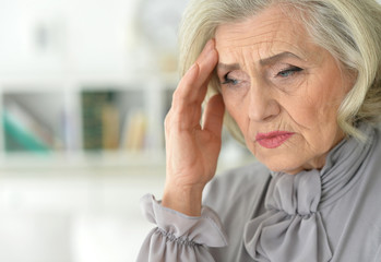 senior woman with  headache 