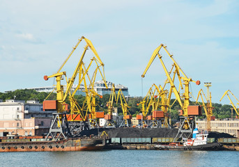 Fototapeta na wymiar Cargo crane, ship, train and coal