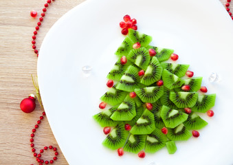 Kiwi Christmas tree - fun food idea for kids party or breakfast, New Year food background