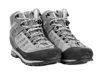 Old boots on white background, b/w tone