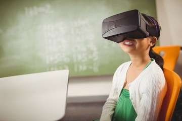 Seated girl wearing virtual reality glasses 