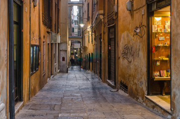 Fototapeta na wymiar Vico Del Duca, an old narrow but lively street in the ancient part of the city of Genoa