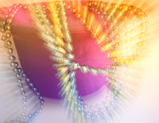 Hat, high inverted cylinder and decorative beads on a white background.