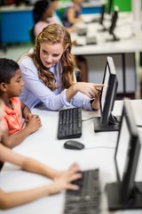 Teacher giving lesson to her students with technology