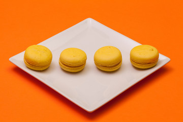 Obraz na płótnie Canvas Traditional french colorful macarons on the plate
