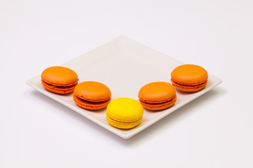 Traditional french colorful macarons on the plate