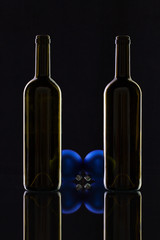 Silhouette of elegant wine bottles and Christmas decoration