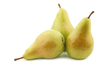 three fresh migo pears on a white background
